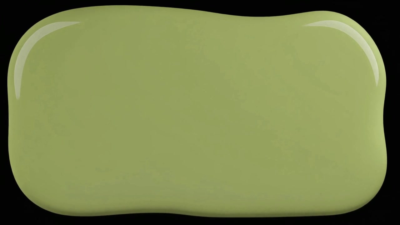 Green Paint Splatter Spreading on Black Background