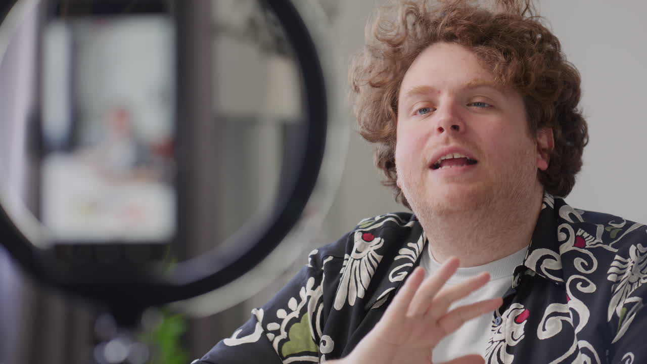 Blogger Speaking in front of Phone and Ring Light during Video Recording