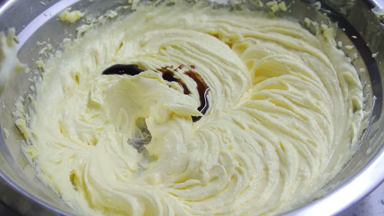 Butter, sugar and other ingredients are mixed together using a hand mixer machine