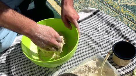 traditional bakery skill handmade flour sour dough bread in a bowl in rural area for cookies and flat bread in clay oven baker chef kneading the mixture prepare for fermentation in the town in gilan