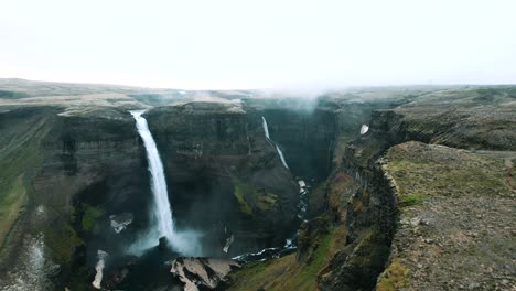 Scenic-landscape-of-Haifoss-waterfall,-Iceland,-Drone-shot