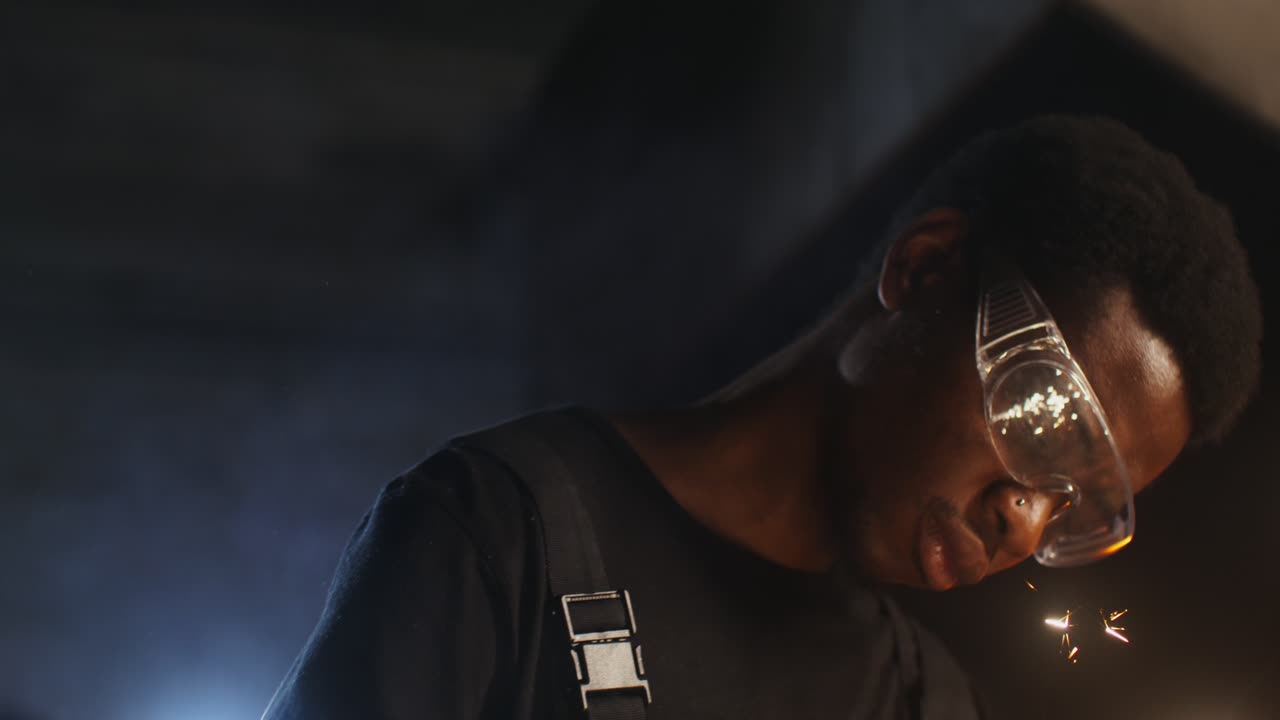 Worker in a dark workshop
