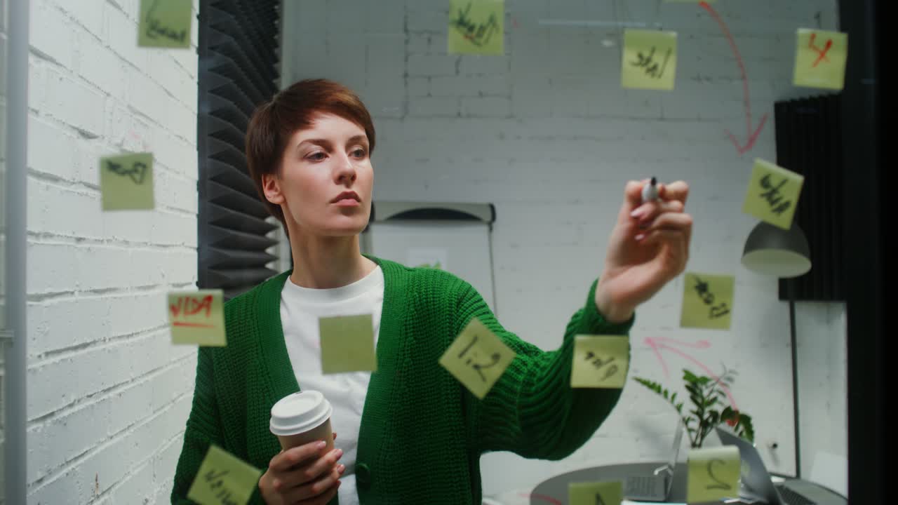 Woman in office brainstorming