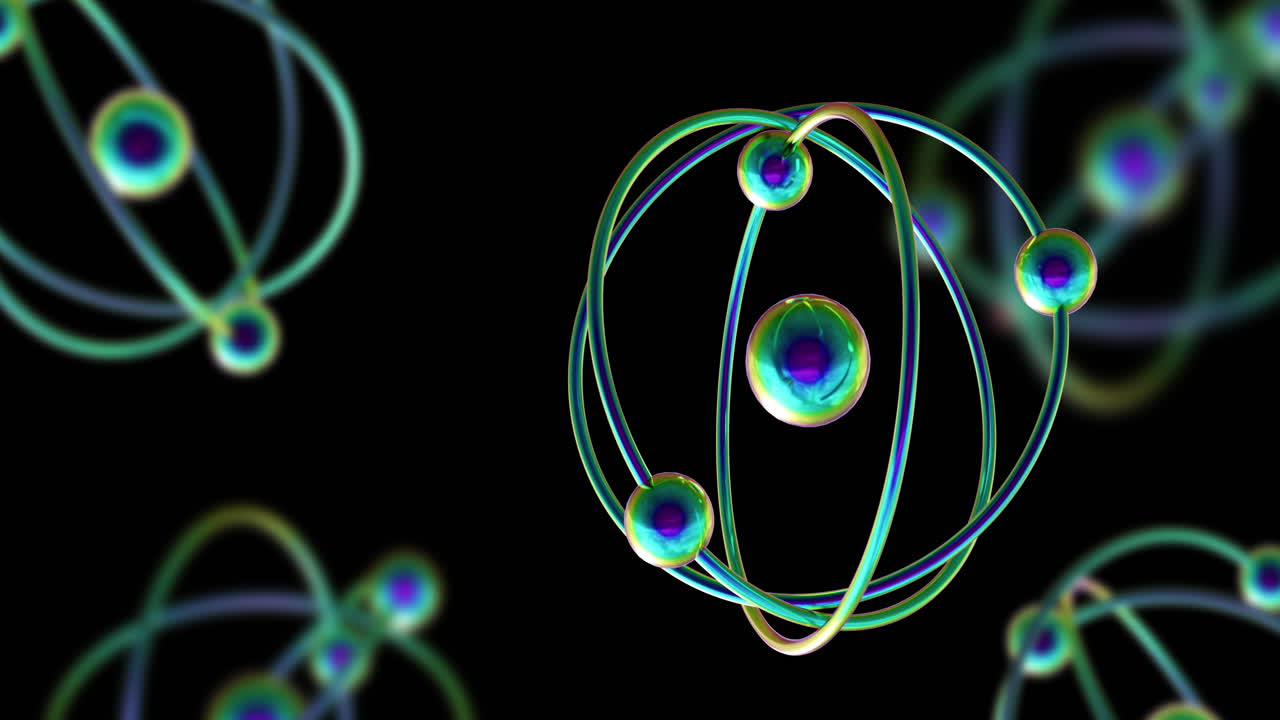 Animation of atom models spinning on black background