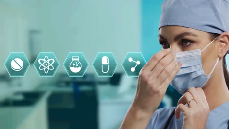 Animation-of-hexagon-medical-icons-over-female-doctor-wearing-face-mask