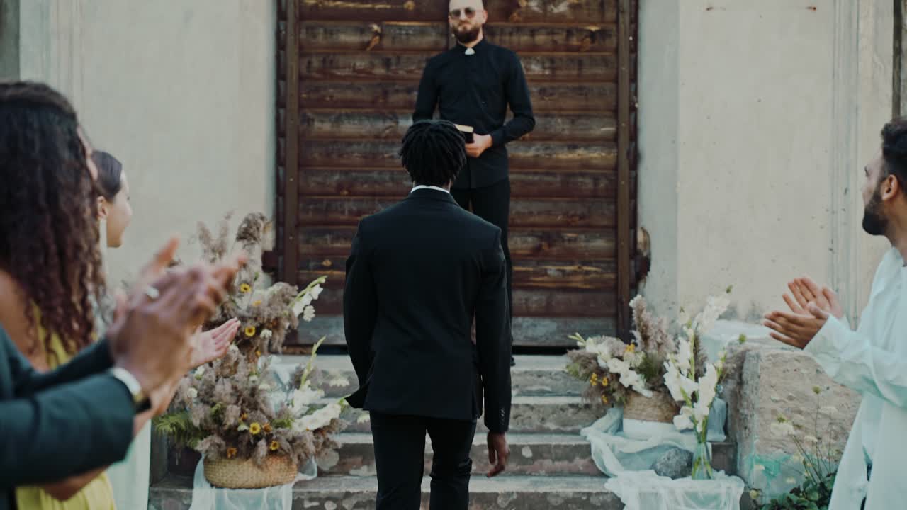 Wedding Ceremony with Priest and Guests