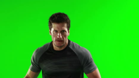 serious rugby player with ball
