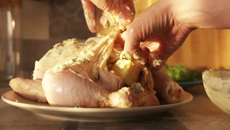 preparing a butter-herb roasted chicken