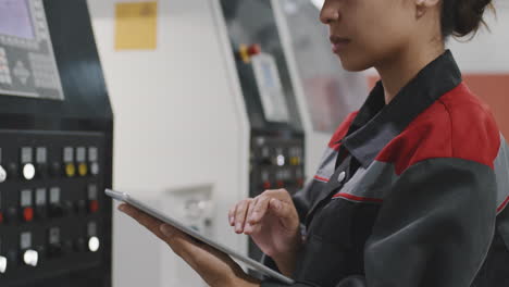 mixed race woman working at factory