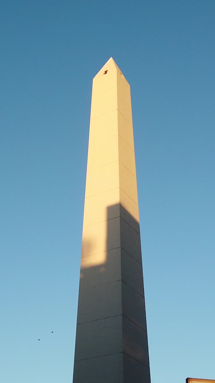 Vertical of Argentine Obelisk Buenos Aires city, landmark, high tall white monument in daylight skyline