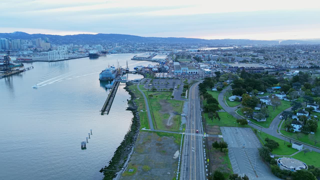 The drone glides over Alameda Point, capturing a bird’s-eye view of its west side and the expansive bay beyond.