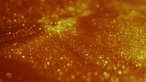 abstract close up macro view of golden dust liquid surface