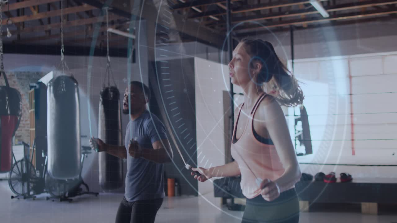 Partners bringing ropes behind and rotating, jumping in sync under digital overlay tracking fitness