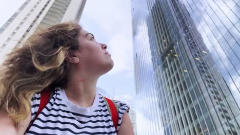 woman in front of skyscrapers