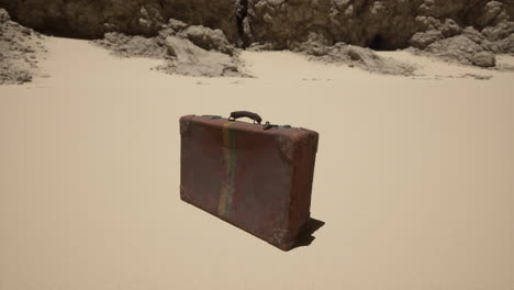 vintage suitcase abandoned in a desert