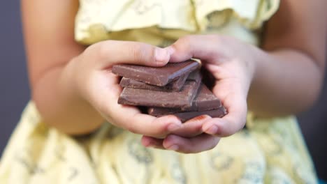 child holding chocolate