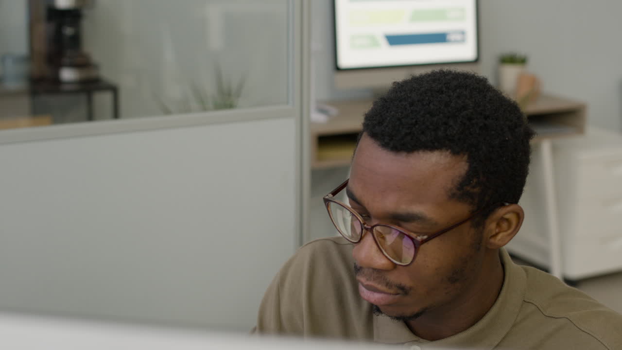 Top View Of Man Working Using Pc Sitting At Desk In The Office