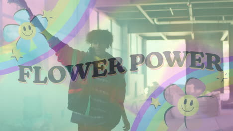 animation of flower power text with rainbow and flowers over man running with smoke bomb