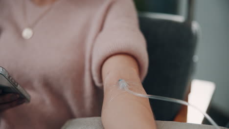 woman receiving iv drip in hospital