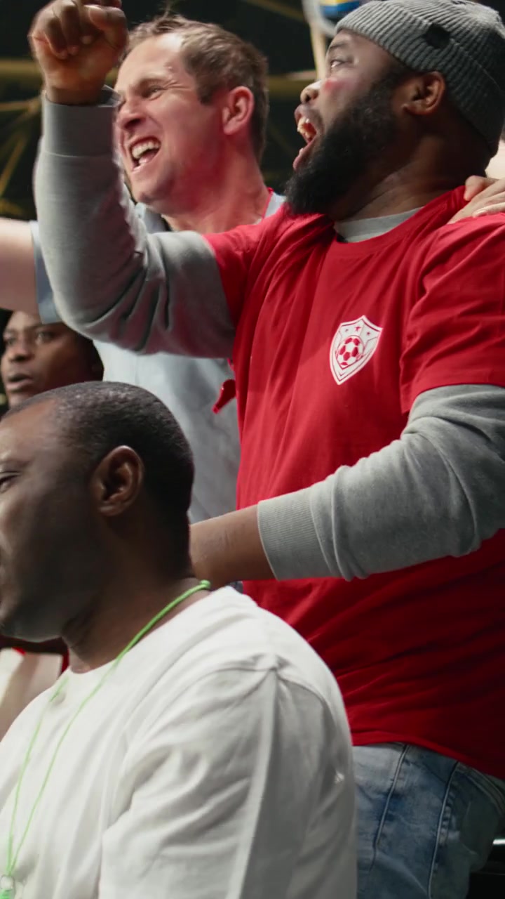 Vertical Video Diverse fans excited of winning ticket for live betting after final whistle