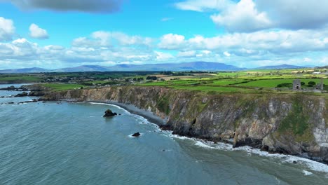 ireland epic locations seascape from drone of the coastline of waterford ireland with the comeragh mountains behind