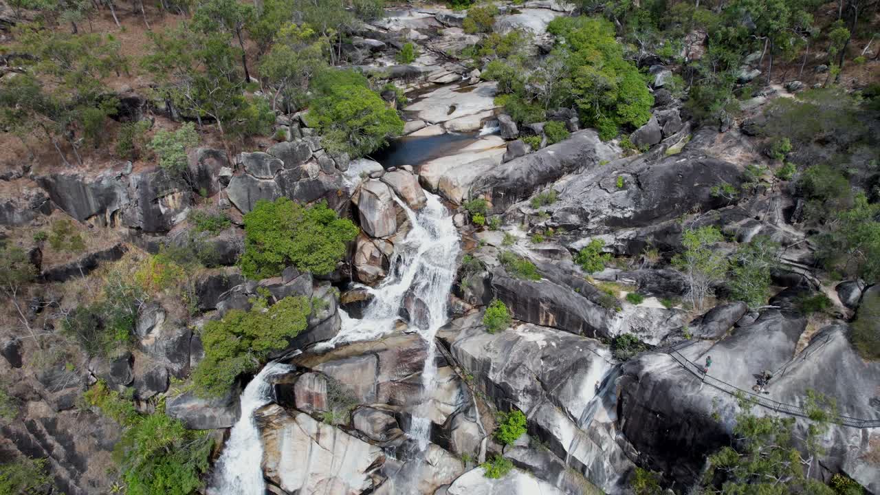 Rocky creek bed at davies creek falls in dinden national park, aerial view