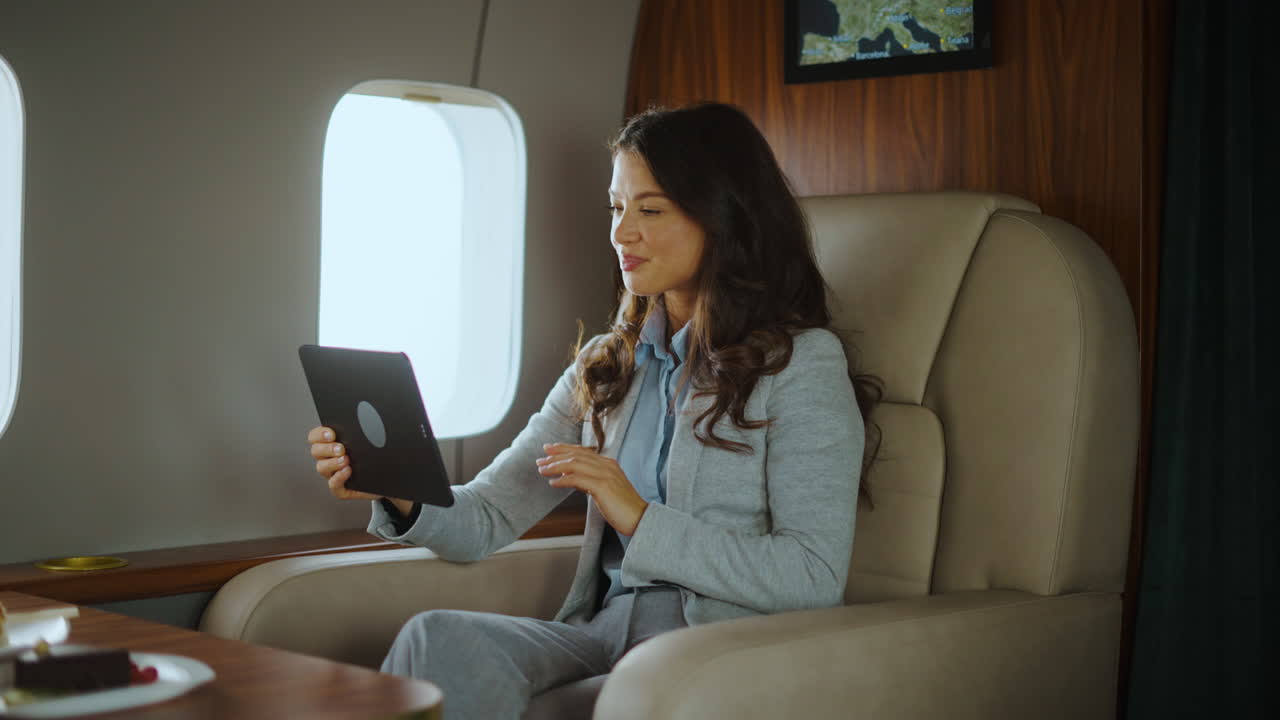 Businesswoman on a Video Call in a Private Jet