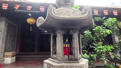 stone shrine with lanterns in hanoi temple