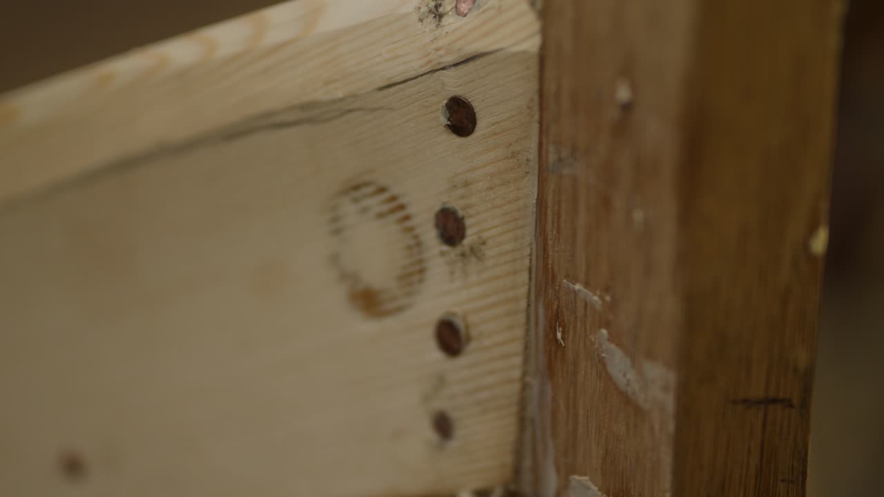Wood boat planks fastened to stem with copper nails
