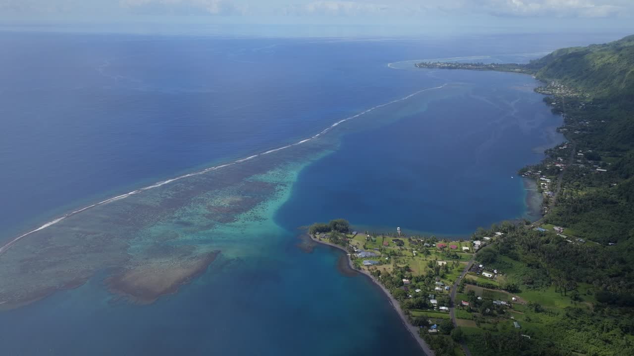 Vallee de Taitira Bay Tahiti French Polynesia aerial drone North Shore village town road Teahupoo passe coral barrier reef Vaitepiha River Taravao Taiarapu South Pacific Ocean morning bluesky backward