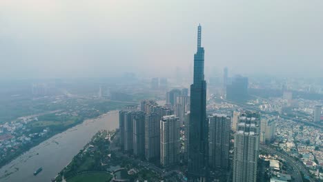 push-in aerial shot of the landmark 81 supertall skyscraper during the day in ho chi minh city, vietnam