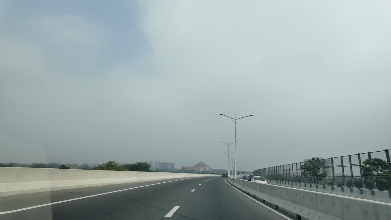 Highway with Street Lights and Distant City Views