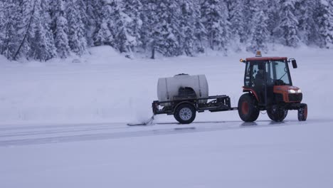 tractor on frozen lake creating ice rink, 4k, banff alberta