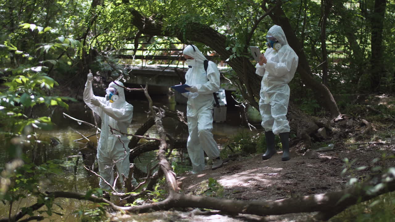 Environmental Researchers Conducting Water Quality Test in a Forest