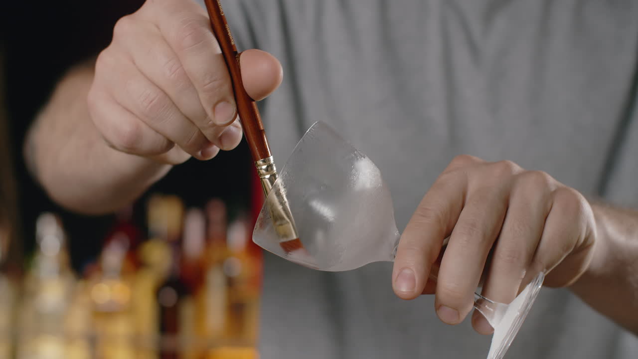 Bartender Applying a Frosting to an Iced Cocktail Glass