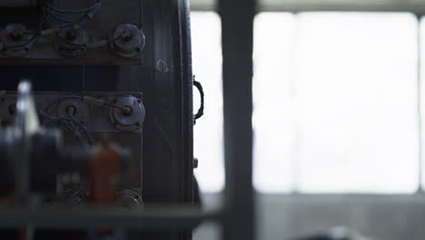 Closeup-tyre-production-machine-working-with-background-worker-controlling