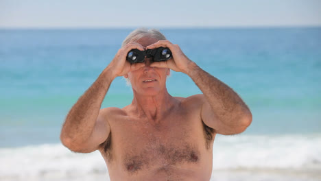 Man-looking-through-binoculars