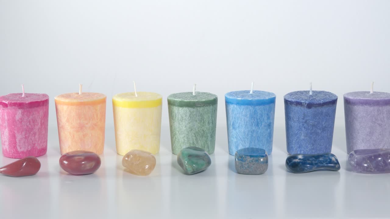 The seven chakra system candles and gemstones