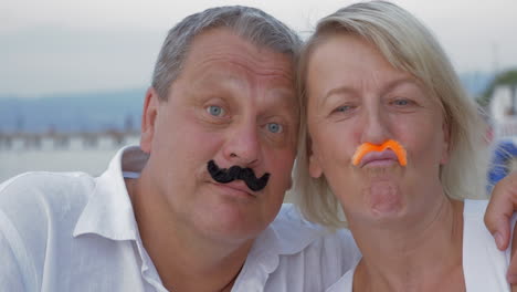 funny senior couple with moustache