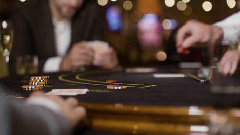 people playing poker at the casino.