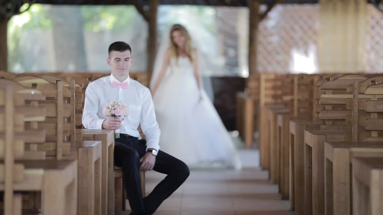 Newly Wedded Couple In The Alcove. Young and beautiful bride and groom in the alcove