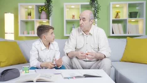 Grandfather-is-trying-to-do-his-homework-with-his-grandson.