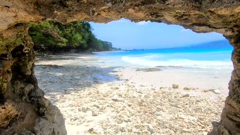 beautiful shoreline view under a hole of piled rocks