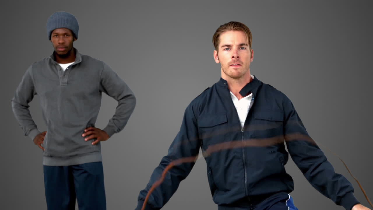 회색 배경에 그의 코치 에 점프 로프와 함께 점프하는 사람