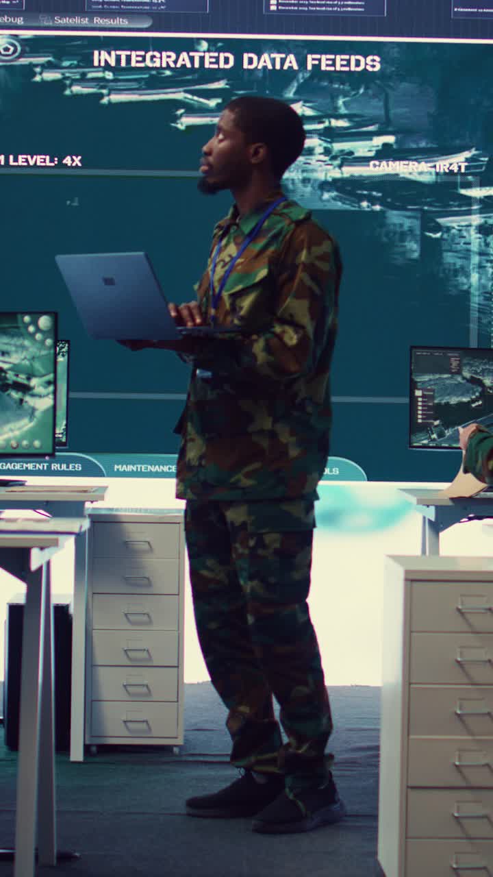 Military Man in Camouflage Uniform Working on Laptop in Control Room
