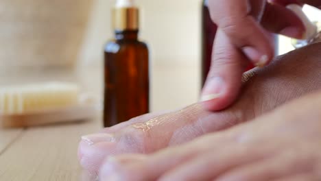 applying foot or nail care oil