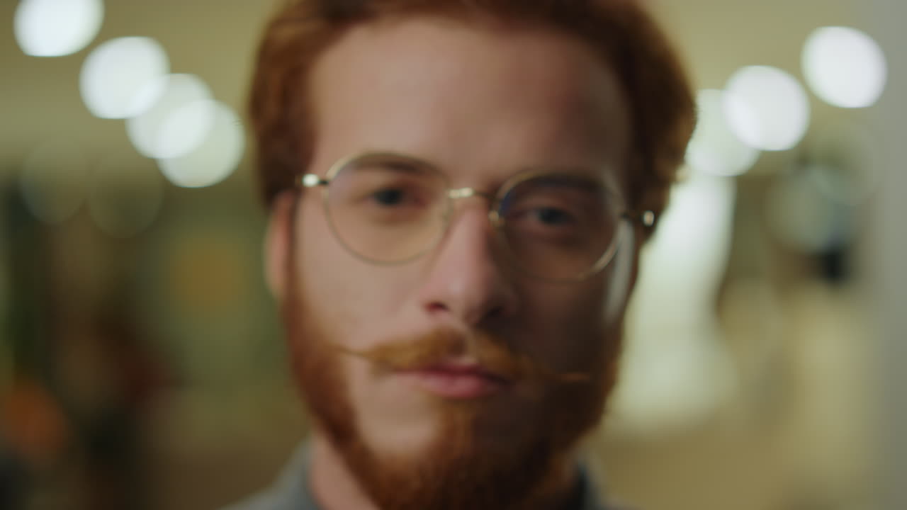 Closeup smart student posing camera. Confident businessman portrait