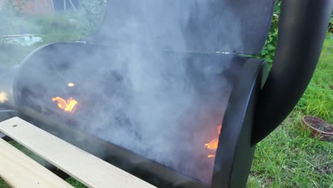 smoke flies from the lit grill. barbeque theme