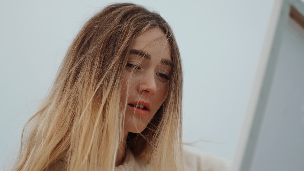 Woman looking at a painting