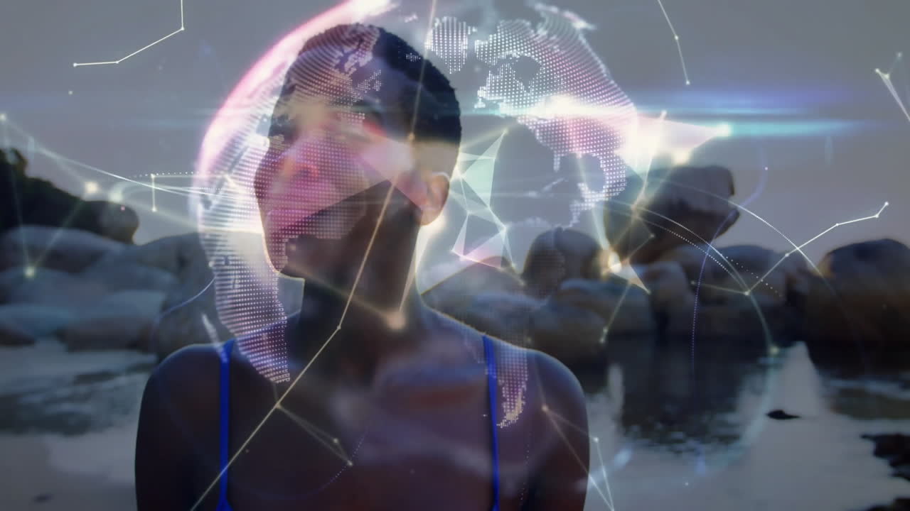 At beach, woman interacting with animation of digital globe and data connections